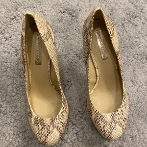 Used BCBG Maxazria snake/animal print size 6 1/2. Worn 2-3 times. No box.